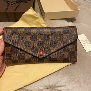 Authentic Louis Vuitton emilie wallet with red detailing